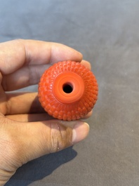A Chinese coral-red Peking glass snuff bottle imitating a basket, 19th C.