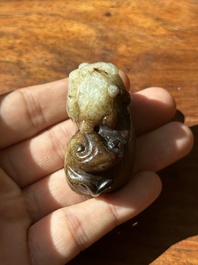 A Chinese celadon and russet jade mythical beast carving, Ming