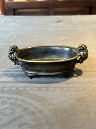 A rare Chinese bronze narcissus basin-shaped censer with dragon handles, Xuande mark, 17th C.