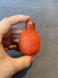 A Chinese coral-red Peking glass snuff bottle imitating a basket, 19th C.