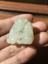 A Chinese white jade sculpture of a boy and a double gourd, Qing