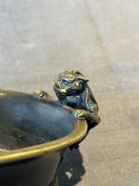 A rare Chinese bronze narcissus basin-shaped censer with dragon handles, Xuande mark, 17th C.