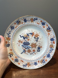 A Dutch Delft Imari-style dish with antiquities, 'AK' mark, 18th C.