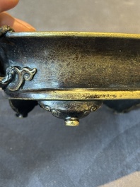 A rare Chinese bronze narcissus basin-shaped censer with dragon handles, Xuande mark, 17th C.