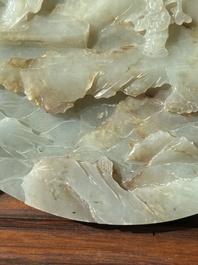A Chinese celadon and russet jade plaque with landscape design, 19th C.