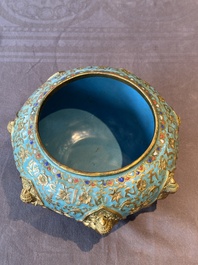 A Chinese gilt and champlev&eacute; enamelled bronze bowl with Buddhas in relief, 19/20th C.