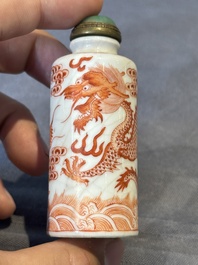 A Chinese jade carving, a tortoiseshell card holder and an iron-red snuff bottle, 19th C.