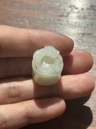 A Chinese white jade carving of a chilong reclining on bamboo, Qing