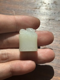 A Chinese white jade carving of a chilong reclining on bamboo, Qing