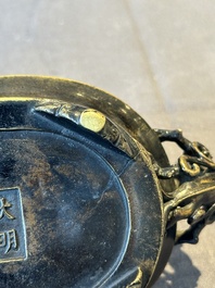 A rare Chinese bronze narcissus basin-shaped censer with dragon handles, Xuande mark, 17th C.