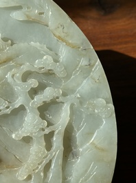 A Chinese celadon and russet jade plaque with landscape design, 19th C.