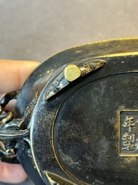 A rare Chinese bronze narcissus basin-shaped censer with dragon handles, Xuande mark, 17th C.