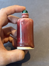 Two Chinese copper-red-glazed snuff bottles, Kangxi mark, 19th C.