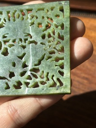 A Chinese jade 'dragon' plaque, a 'double-happiness' plaque and a jade inset silver brooch, 19th C.
