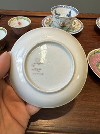 A pair of Chinese famille verte and a pair of famille rose cups and saucers, Kangxi/Yongzheng