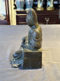 A rare Chinese parcel-gilt and lacquered pewter Guanyin, 17/18th C.