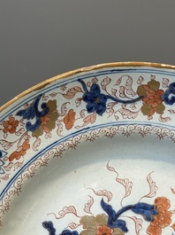 A Dutch Delft Imari-style dish with antiquities, 'AK' mark, 18th C.