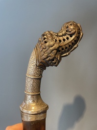 A silver plated dagger and four swords, China, Burma and Indonesia, 18/19th C.