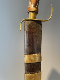 A silver plated dagger and four swords, China, Burma and Indonesia, 18/19th C.