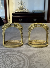 A pair of Chinese imperial gilt-bronze stirrups with dragons, De 德 mark, 18th C.