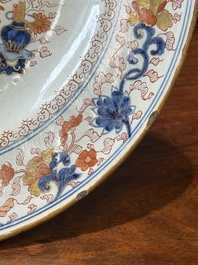A Dutch Delft Imari-style dish with antiquities, 'AK' mark, 18th C.