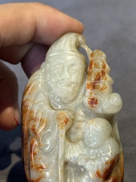 A Chinese jade carving, a tortoiseshell card holder and an iron-red snuff bottle, 19th C.