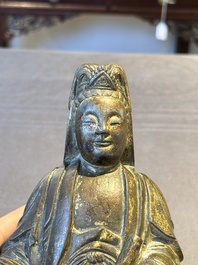 A rare Chinese parcel-gilt and lacquered pewter Guanyin, 17/18th C.
