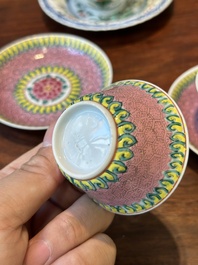 A pair of Chinese famille verte and a pair of famille rose cups and saucers, Kangxi/Yongzheng