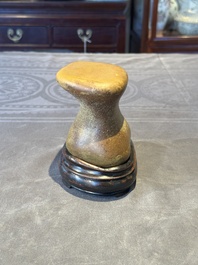 A Chinese scholar's rock on wooden stand, Ming or later