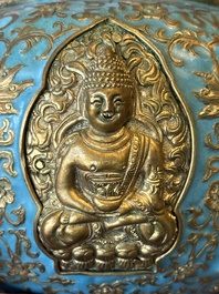 A Chinese gilt and champlev&eacute; enamelled bronze bowl with Buddhas in relief, 19/20th C.