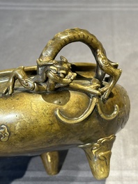 A Chinese imperial archaistic gold-splashed bronze censer and cover with chilong and 'shou' design, Xuande mark, 17th C.