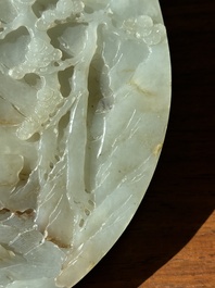 A Chinese celadon and russet jade plaque with landscape design, 19th C.