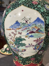 A pair of Chinese famille rose black-ground jars and covers with mountainous landscape design, Yongzheng