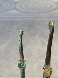 A varied collection of six Chinese bronze belt hooks, Warring States period and Western Han