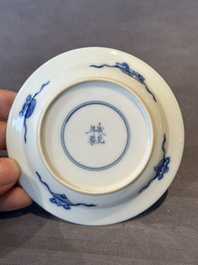 A Chinese blue and white 'erotic' cup and saucer, Kangxi
