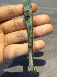A varied collection of six Chinese bronze belt hooks, Warring States period and Western Han