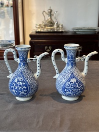 A pair of Chinese blue and white ewers with floral design, Kangxi