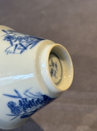 A Chinese blue and white 'erotic' cup and saucer, Kangxi