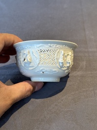 A pair of rare Chinese reticulated white-glazed biscuit 'Eight Immortals and Shoulao' bowls, Wanli