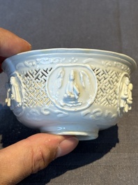 A pair of rare Chinese reticulated white-glazed biscuit 'Eight Immortals and Shoulao' bowls, Wanli