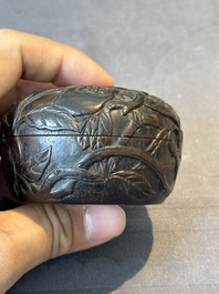 A Chinese huanghuali wooden box and cover with pomegranate design, 17/18th C.