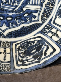 A Chinese blue and white kraak porcelain dish with flowers in a jardiniere, Wanli