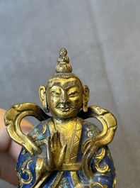 A Chinese gilt and champlev&eacute; enamelled bronze Bodhisattva on a carved stone stand, Qing