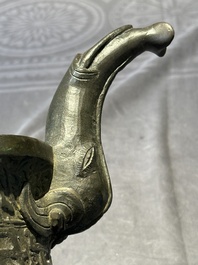 A Chinese bronze 'elephant' tripod censer and cover, Ming