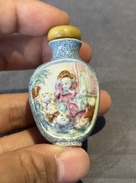 A Chinese moulded famille rose 'playing boys' snuff bottle, Qianlong mark, 19th C.