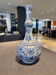A Chinese blue and white 'lotus scroll' bottle vase, Transitional period