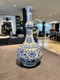 A Chinese blue and white 'lotus scroll' bottle vase, Transitional period