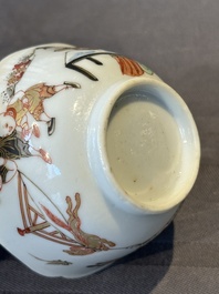 A Chinese polychrome cup and saucer with figures and a dog, Yongzheng