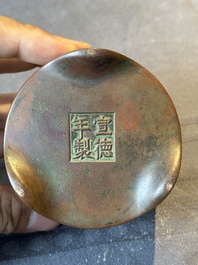 A small Chinese bronze cylindric tripod censer, Xuande mark, Ming