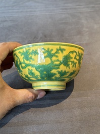A pair of Chinese yellow-ground 'peach and bird' bowls, Qianlong mark and probably of the period